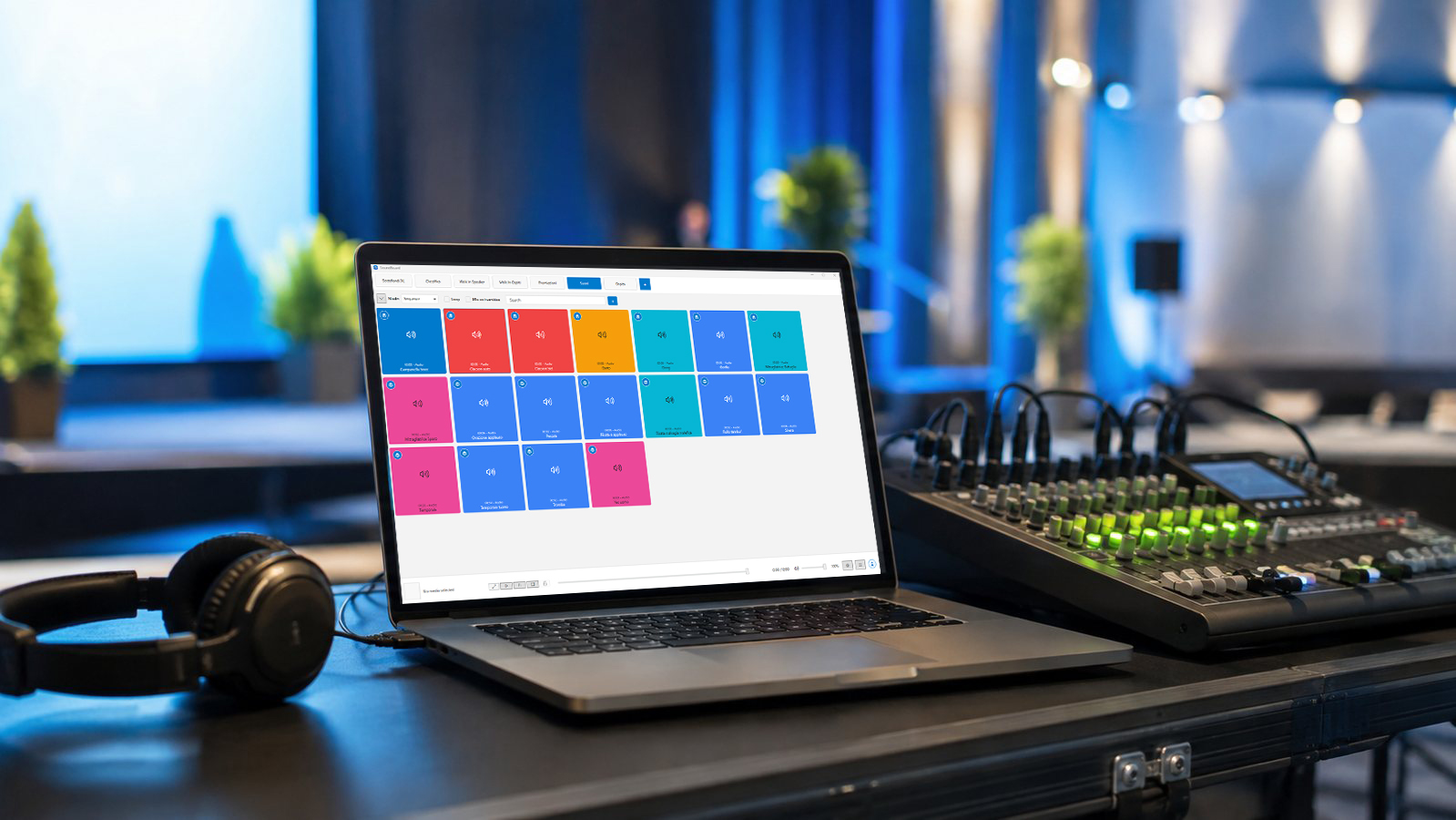 Live event operator desk with a media control laptop